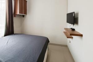 Μια τηλεόραση ή/και κέντρο ψυχαγωγίας στο Wisma Al Iman Syariah 25 Mitra RedDoorz