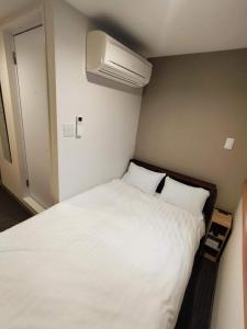 Ліжко або ліжка в номері FLYCAT INN 伊勢