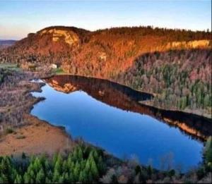 an aerial view of a river in a canyon at Gîte des lacs et cascades in Bonlieu