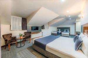 Postel nebo postele na pokoji v ubytování MED Airport Hotel