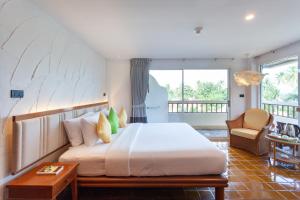 Postel nebo postele na pokoji v ubytování Samui Natien Resort
