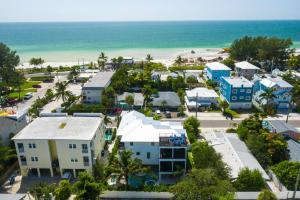 an aerial view of a resort with the beach at Island Sol in Bradenton Beach