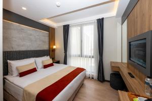 Postel nebo postele na pokoji v ubytování Harmony Istanbul