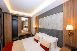 Postel nebo postele na pokoji v ubytování Harmony Istanbul