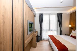 Postel nebo postele na pokoji v ubytování Harmony Istanbul