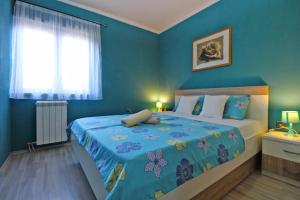 Postel nebo postele na pokoji v ubytování Apartment Josip 1649