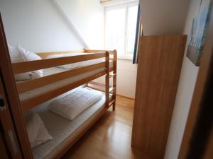 A bed or beds in a room at Apartment St Margarethen near Ski Lift