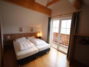 A bed or beds in a room at Apartment St Margarethen near Ski Lift