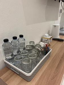 a tray of glass jars sitting on a floor at Stay at 115 in Hat Yai +16 photos