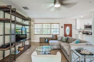 a living room with a couch and a table at Beautiful Comfy Home With Private Hot Tub Close To Beach home in Fort Lauderdale +23 photos