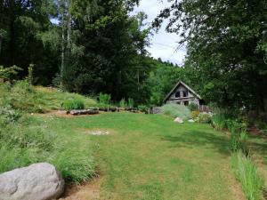 a yard with a house in the background at Cabanon in Sapois +26 photos