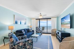 a living room with a couch and chairs at Windward Pointe Condominiums in Orange Beach +125 photos