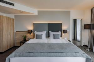 Postel nebo postele na pokoji v ubytování Garner Hotel Berlin - Spandau by IHG