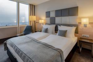 Postel nebo postele na pokoji v ubytování Garner Hotel Berlin - Spandau by IHG