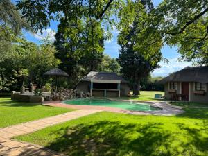 a house with a swimming pool in a yard at Silken Trap Accommodation NO LOADSHEDDING in Johannesburg