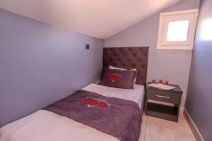 Letto o letti in una camera di Ruby Hotel