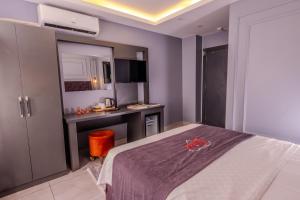 Letto o letti in una camera di Ruby Hotel