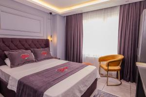 Letto o letti in una camera di Ruby Hotel
