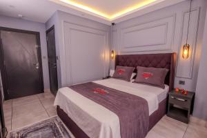 Letto o letti in una camera di Ruby Hotel