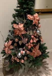 a christmas tree with ornaments on it at Casa Baia Flaminia in Pesaro