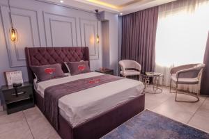 Letto o letti in una camera di Ruby Hotel