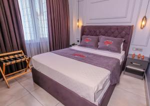 Letto o letti in una camera di Ruby Hotel