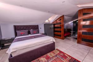 Letto o letti in una camera di Ruby Hotel