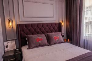 Letto o letti in una camera di Ruby Hotel
