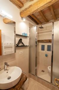 a bathroom with a sink and a shower at UC - Guest House Gerardo in Perugia