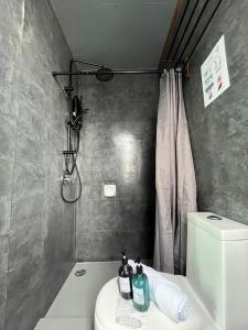 a bathroom with a sink and a toilet and a shower at Industrial Luxe Concrete Bliss, near Sunway Pyramid,Subang Jaya in Subang Jaya +32 photos