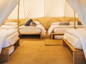 Lodg'ing Nature Camp Anjou客房内的一张或多张床位