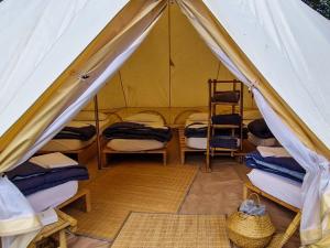 Lodg'ing Nature Camp Anjou客房内的一张或多张床位
