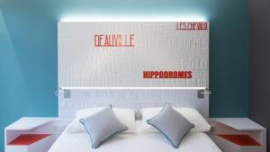 Кровать или кровати в номере ibis Styles Deauville Centre