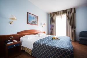 Postelja oz. postelje v sobi nastanitve Hotel Levante