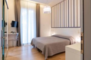 Posteľ alebo postele v izbe v ubytovaní Perla Verde Hotel