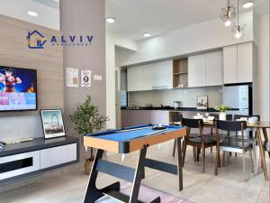 a kitchen and dining room with a ping pong table at Atlantis Melaka by Alviv Management in Melaka