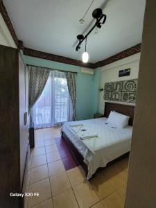 Postel nebo postele na pokoji v ubytování Dalyan Nehir suit hotel + 20 fotografií