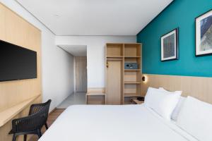 Un ou plusieurs lits dans un hébergement de l'établissement Rihab Hotel