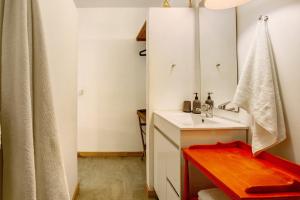 a bathroom with a sink and a mirror at Calheta Beach House T2 in Calheta +23 photos