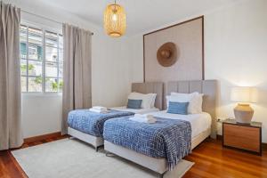 Ένα ή περισσότερα κρεβάτια σε δωμάτιο στο Sunny House by Homie