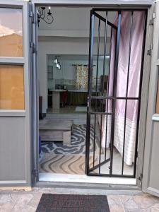 an open door to a room with a living room at Hebergement beau bassin in Beau Bassin