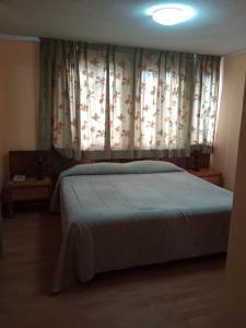 Postel nebo postele na pokoji v ubytování Hotel Balia Casino