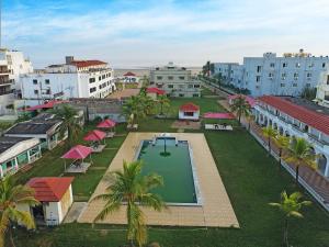 an aerial view of a city with a swimming pool at Silver Sand Eco Resort !! Beachfront !! in Mandarmoni