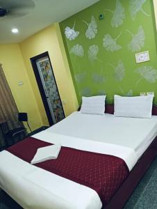 Postel nebo postele na pokoji v ubytování Hotel Swagat
