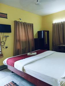 Postel nebo postele na pokoji v ubytování Hotel Swagat