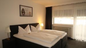 Postel nebo postele na pokoji v ubytování Hotel Zur Kripp