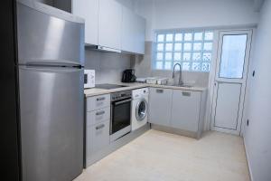 Kuchyň nebo kuchyňský kout v ubytování Grec Maison Piraeus by GrecCollection
