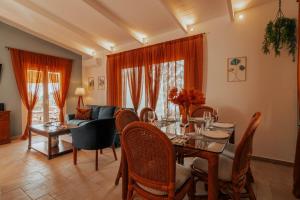 a living room with a table and a couch at Kastraki Sea View in Tolo