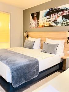 Posteľ alebo postele v izbe v ubytovaní Leonardo Hotel Vienna Hauptbahnhof