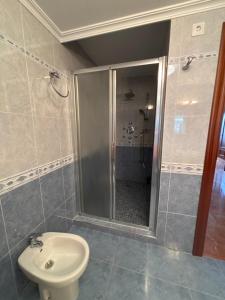 a bathroom with a shower and a toilet and a sink at Casa Frijol 20metres from the beach in Los Alcázares